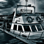 Dark 'n' Stormy, dark ocean artwork, Boat art prints, ocean artwork, Australian photographer, Australian art prints, fishing boat photography, Mornington Pier photography, Monochrome art prints, monochrome framed art, dark ocean aesthetic, Moody Boat art, ocean lover art, Australian photographer, LJT Photography,